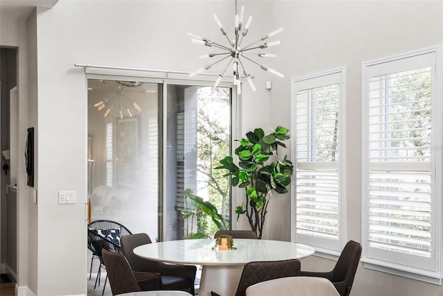 dining room featuring a chandelier and a wealth of natural light