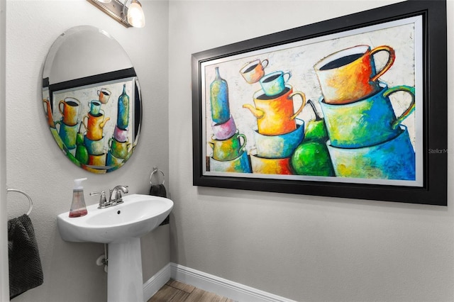 bathroom with sink and wood-type flooring