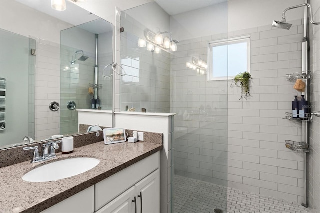 bathroom with vanity and an enclosed shower