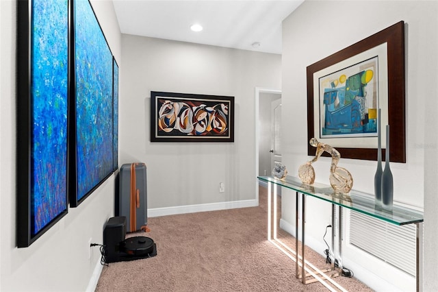 hall with carpet flooring