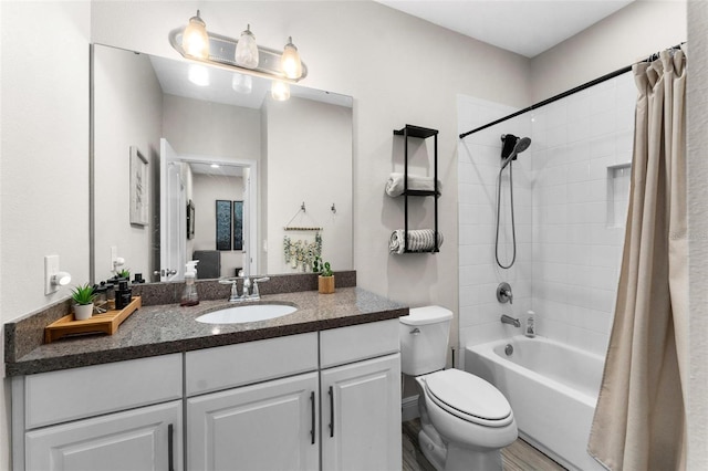full bathroom featuring vanity, toilet, and shower / bath combo with shower curtain