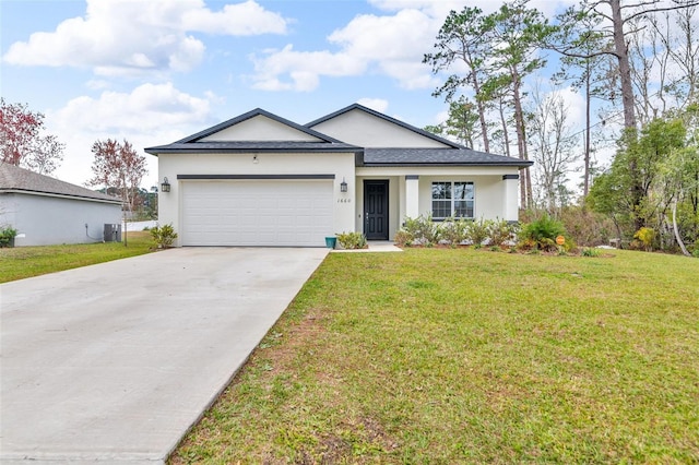 ranch-style house featuring a garage and a front yard