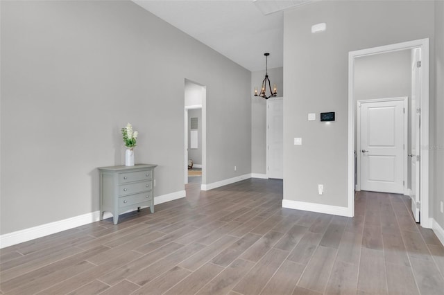 interior space with a notable chandelier and light wood-type flooring