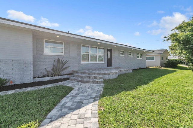 ranch-style house with a front yard