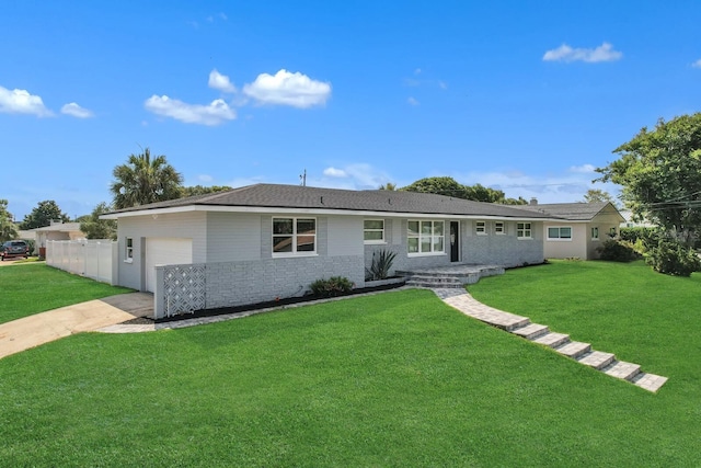 single story home with a garage and a front yard