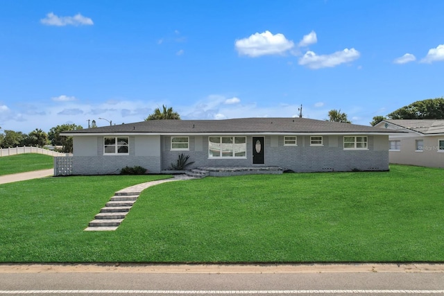 single story home with a front lawn