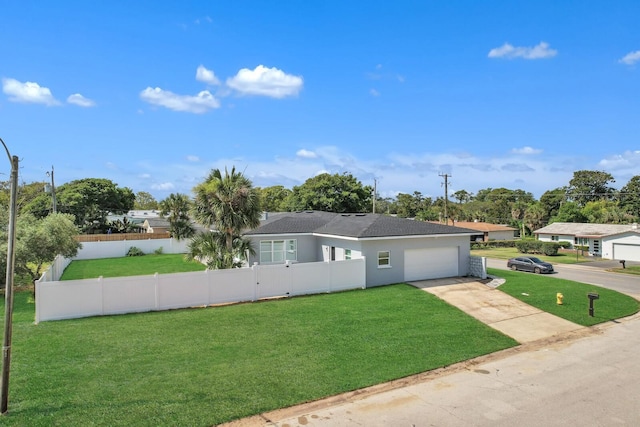 view of front of house with a garage and a front yard