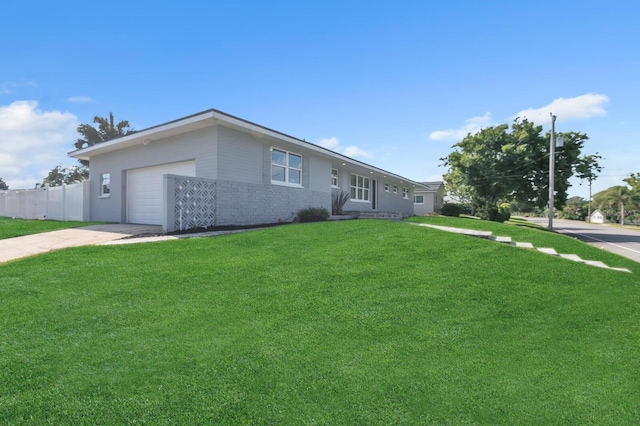 ranch-style home with a garage and a front yard