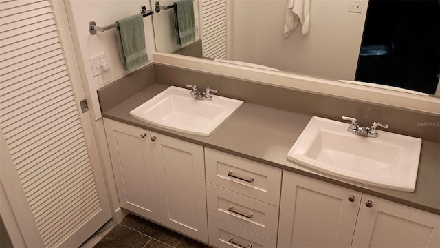 bathroom featuring vanity and tile patterned flooring