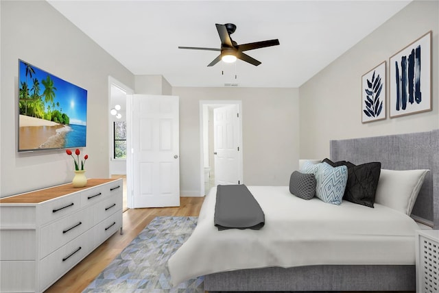 bedroom featuring ceiling fan and light hardwood / wood-style flooring