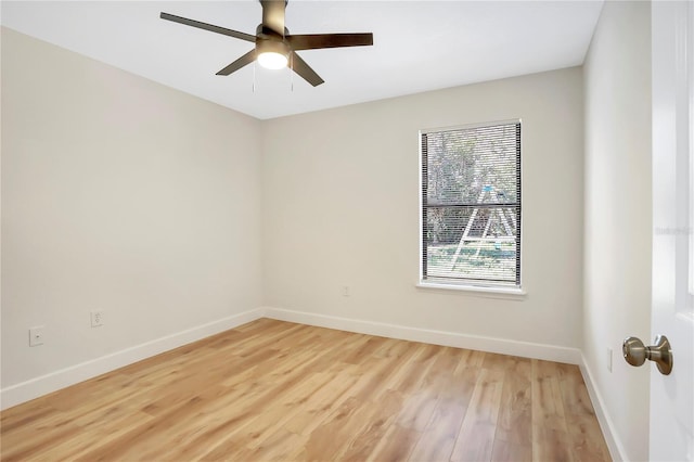 empty room featuring ceiling fan and light hardwood / wood-style floors