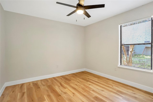 unfurnished room with hardwood / wood-style flooring and ceiling fan