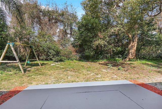 view of yard with a playground and a patio