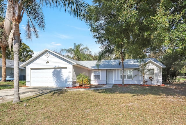 single story home featuring a garage and a front lawn