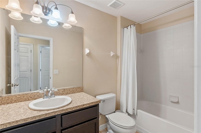 full bathroom featuring shower / bath combination with curtain, vanity, toilet, and a textured ceiling