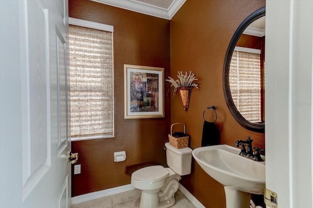 bathroom featuring toilet, tile patterned flooring, and sink