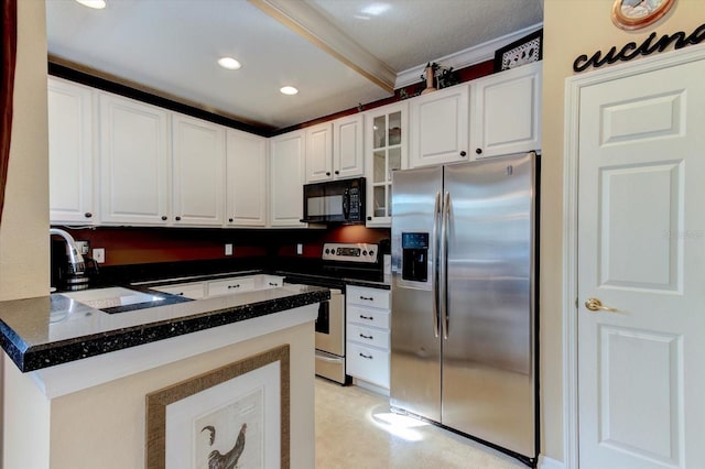 kitchen featuring appliances with stainless steel finishes, kitchen peninsula, and white cabinets