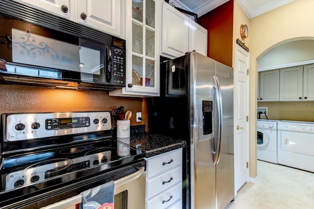 kitchen featuring dark stone countertops, stainless steel appliances, ornamental molding, white cabinets, and separate washer and dryer