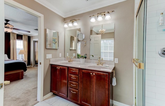 bathroom featuring tile patterned floors, a shower with shower door, crown molding, vanity, and ceiling fan