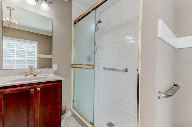 bathroom with a shower with door and vanity