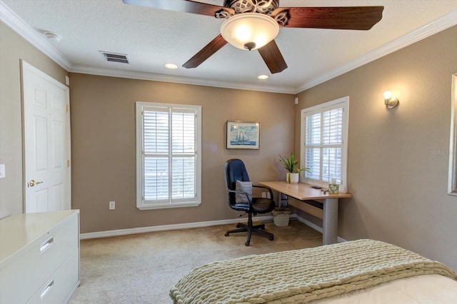 carpeted bedroom with ceiling fan, ornamental molding, and a textured ceiling