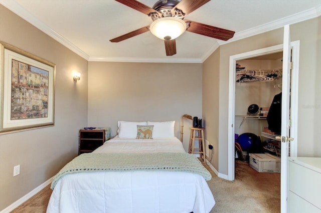 bedroom featuring crown molding, light colored carpet, a spacious closet, and a closet