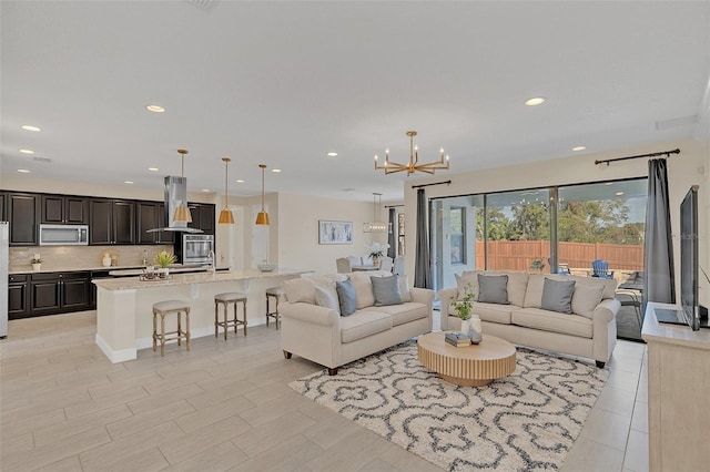 living room with a notable chandelier