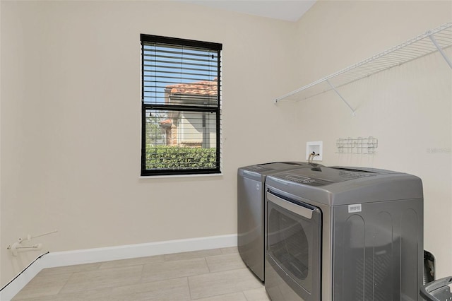 laundry area with independent washer and dryer