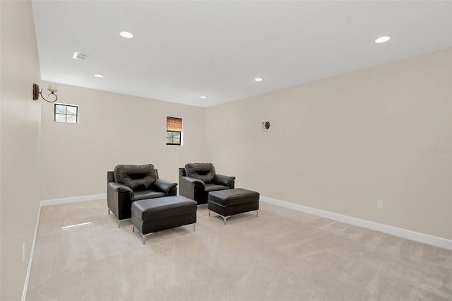 sitting room with light colored carpet