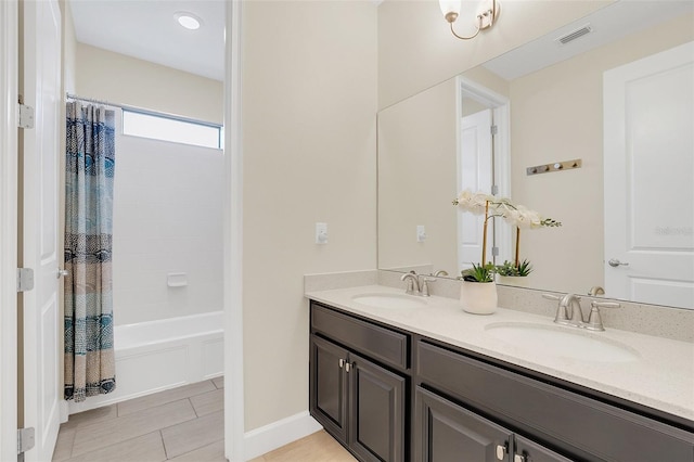 bathroom featuring vanity and shower / bath combination with curtain