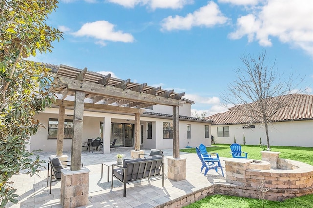 view of patio with a pergola and an outdoor living space with a fire pit