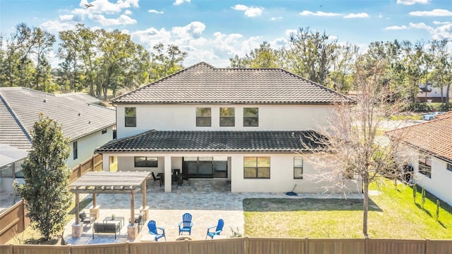 back of house featuring a yard, a pergola, and a patio