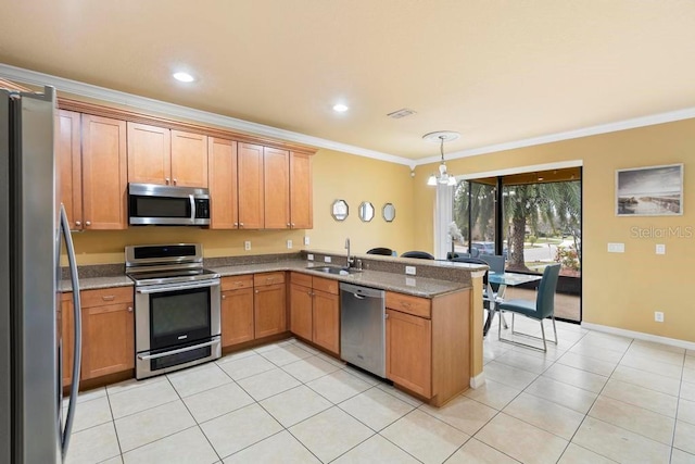 kitchen with pendant lighting, sink, kitchen peninsula, stainless steel appliances, and crown molding