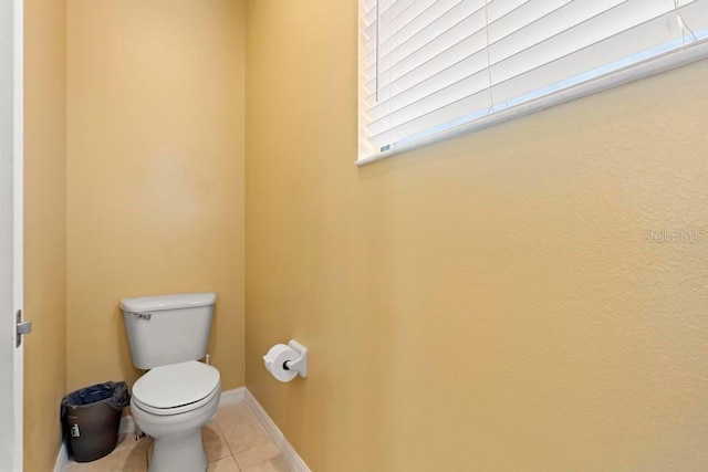 bathroom featuring tile patterned floors and toilet