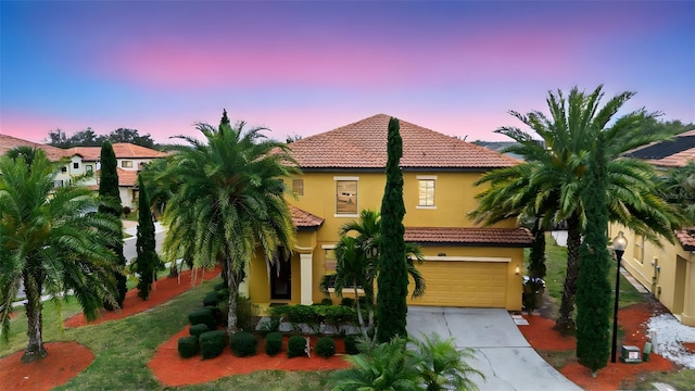 mediterranean / spanish-style house featuring a garage