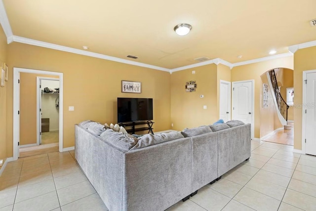 tiled living room featuring crown molding