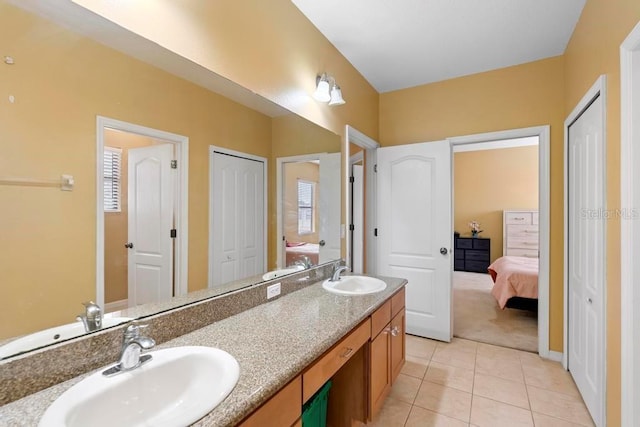 bathroom featuring tile patterned flooring and vanity