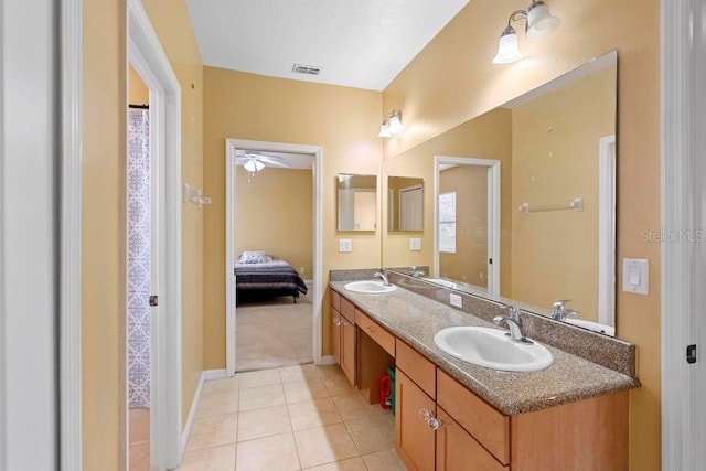 bathroom featuring tile patterned floors and vanity