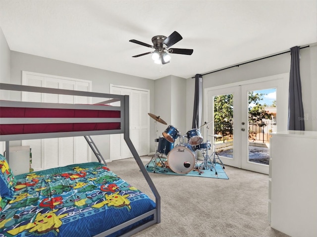 carpeted bedroom with access to exterior, ceiling fan, and french doors