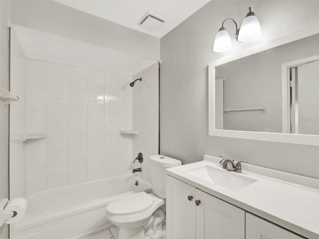 full bathroom featuring vanity, toilet, and tiled shower / bath