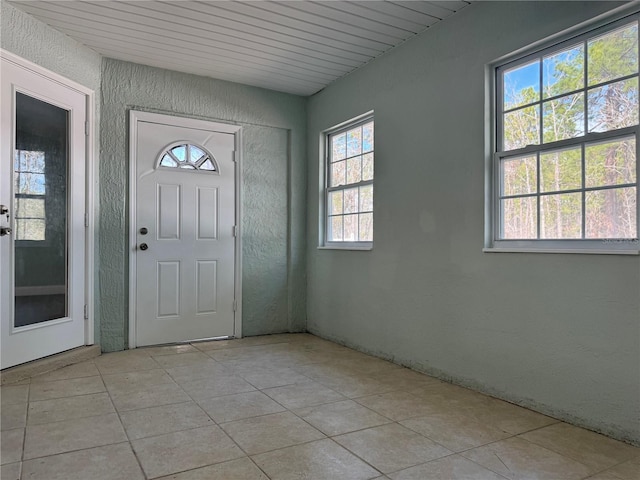 entryway featuring light tile patterned floors