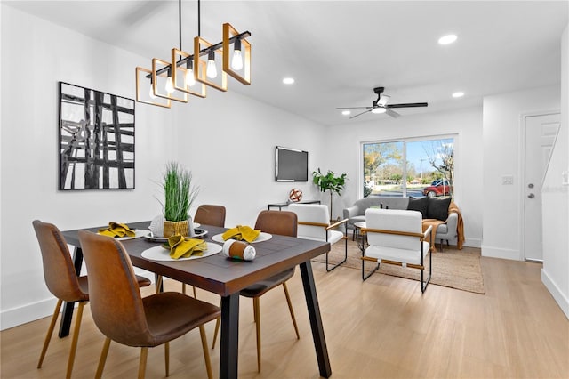 dining room featuring ceiling fan and light hardwood / wood-style flooring