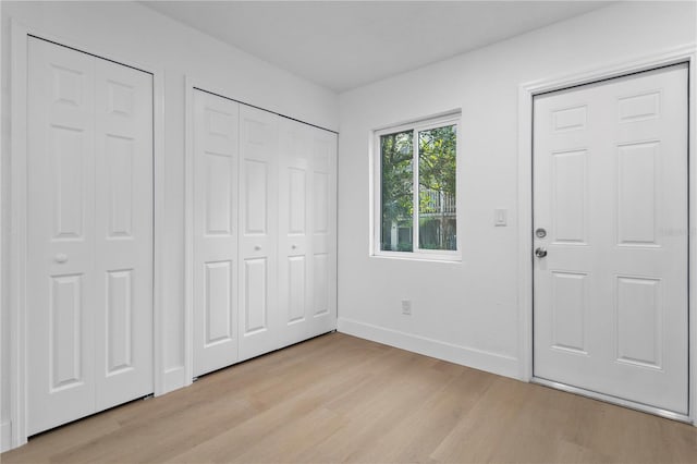 entrance foyer with light hardwood / wood-style floors