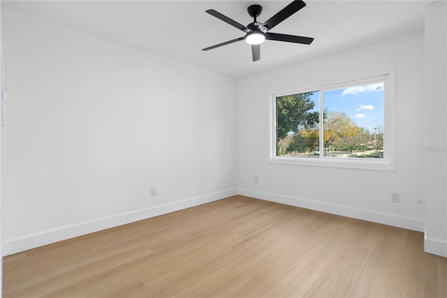 empty room featuring ceiling fan and light hardwood / wood-style floors