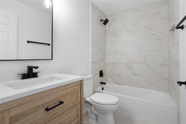 full bathroom featuring vanity, toilet, and tiled shower / bath