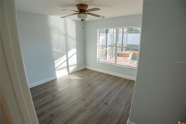 unfurnished room featuring hardwood / wood-style flooring and ceiling fan