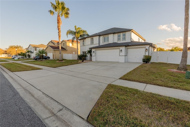 front of property featuring a garage and a front yard