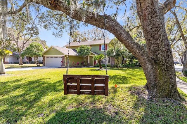 view of front of house featuring a garage and a front yard