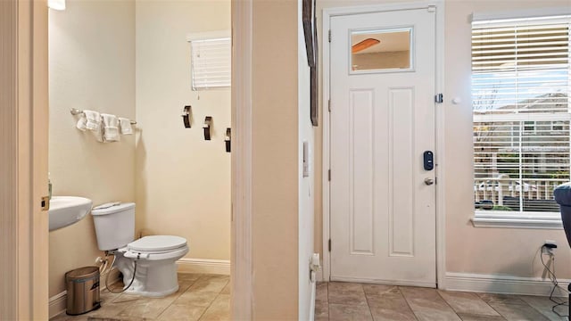 bathroom with tile patterned floors and toilet