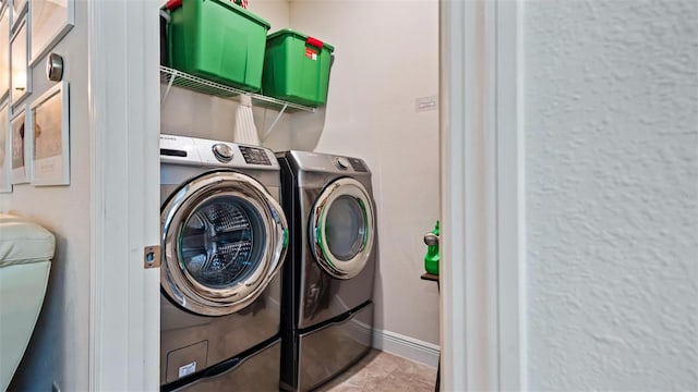 laundry area with washing machine and dryer